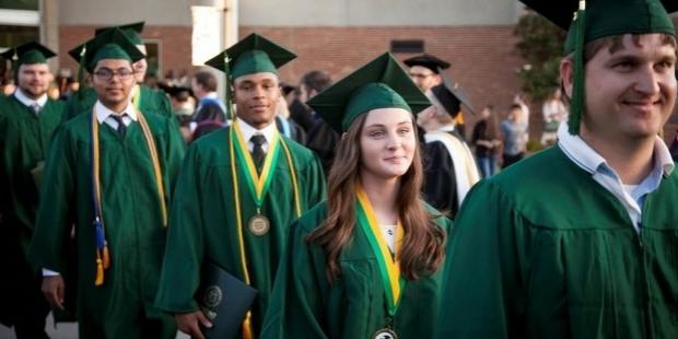 graduates wearing caps and gowns